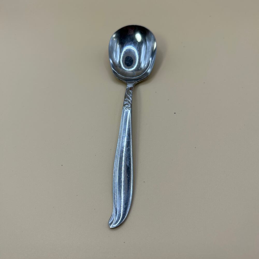 1 Sugar Spoon Dignity Acsons 5 5/8 in Stain on Front Swirl Pattern